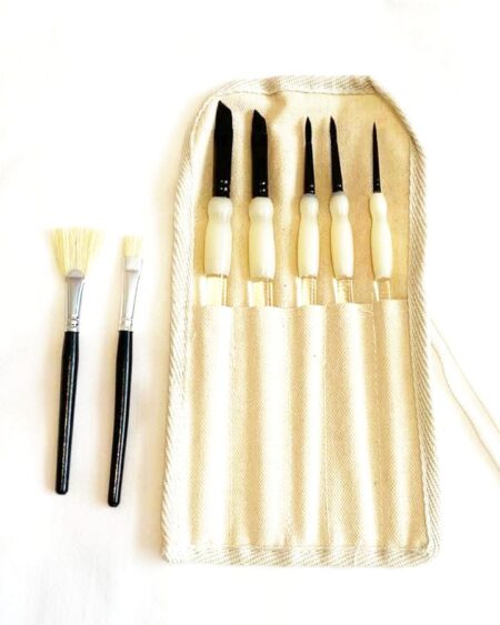 glitter tattoo brushes in a canvas carrying pouch